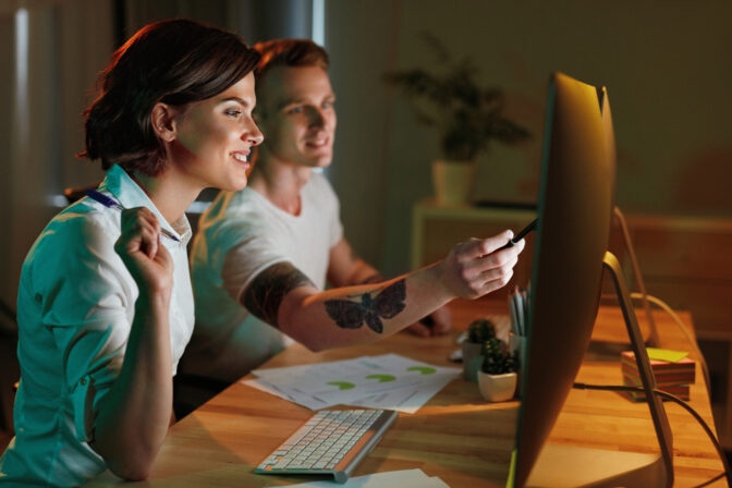 Programmers Writing Software For Website On Computer