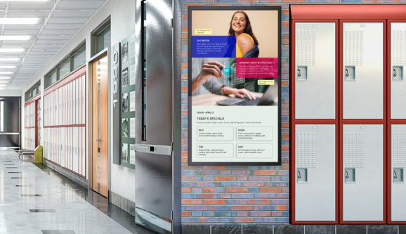 Digital signage screen in school corridor